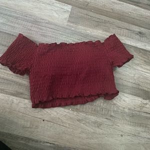 Selling a off the shoulders, burgundy swim top. Size M in kids I believe.